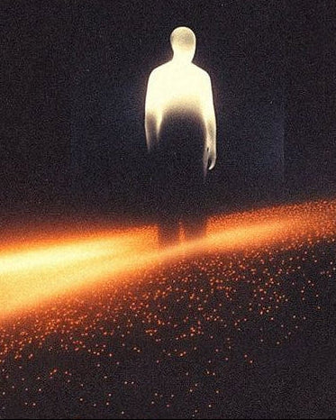 Silhouette of a person standing on a dark path with a bright light source behind them.
